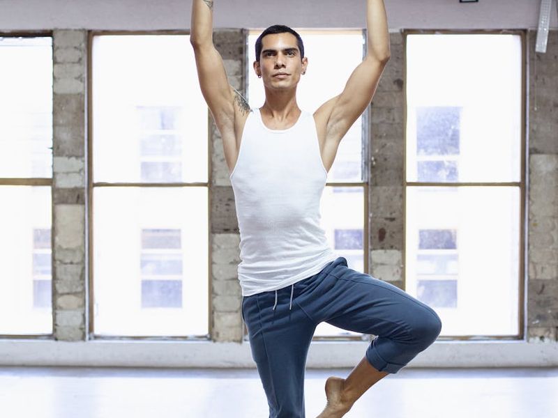 Male athlete focusing on movement in a minimal studio